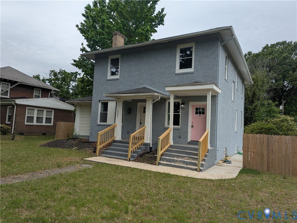 4202 Chamberlayne Avenue, Richmond, VA 23227 Two-story gray exterior with multiple entryways, each featuring a covered porch and wood railings