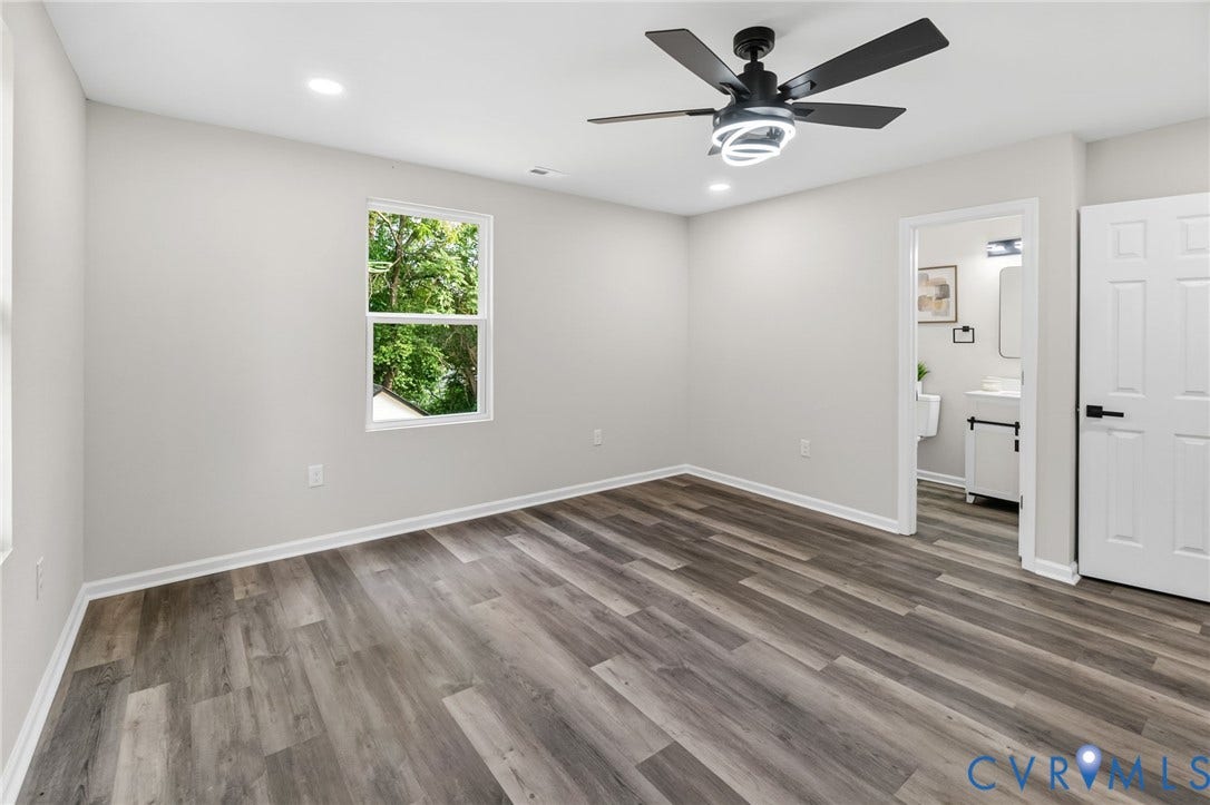 1146 Willcox Street, Petersburg, VA 23803 Spacious room featuring wood-finish flooring, light grey wall tones, a modern ceiling fan with integrated lighting, recessed lighting, and a private attached bathroom