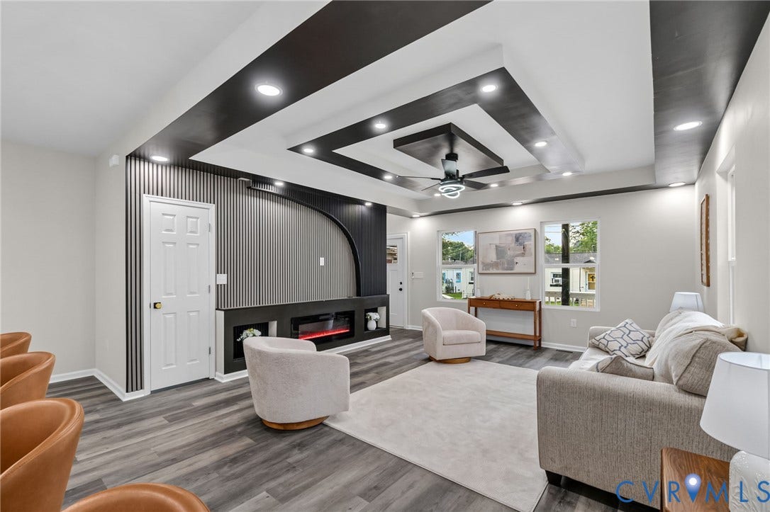 1146 Willcox Street, Petersburg, VA 23803 Living area featuring a multi-tiered tray ceiling with recessed lighting and a ceiling fan