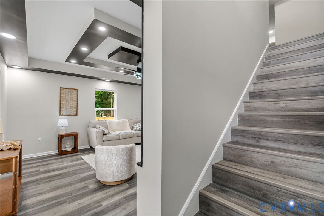 1146 Willcox Street, Petersburg, VA 23803 Wood-finish staircase featuring a light gray wall and white trim