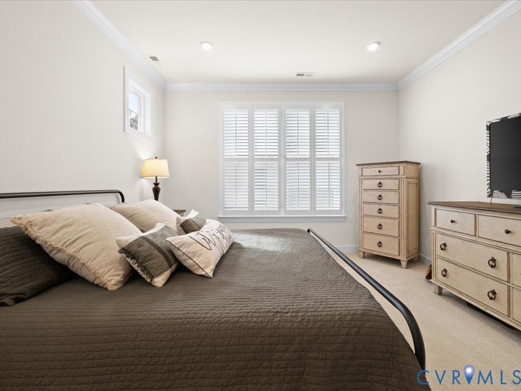 1801 Outrigger Drive, Meadowville Landing, Chesterfield, VA 23836 Window with white plantation shutters, neutral wall color, and crown molding