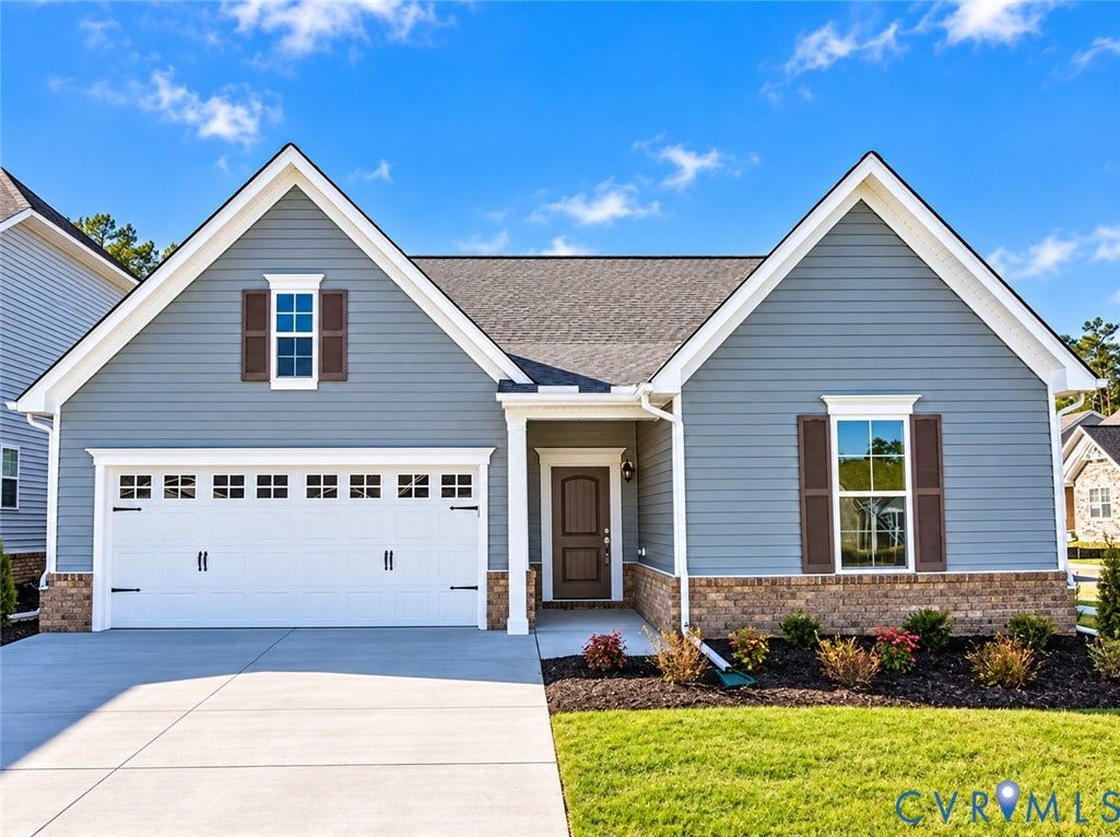 1801 Outrigger Drive, Meadowville Landing, Chesterfield, VA 23836 Gable roofline with architectural shingles, horizontal siding, brick accents, concrete driveway, and attached two-car garage