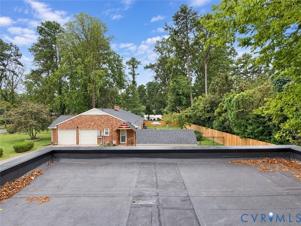 518 Central Terrace, Hopewell, VA 23860 Brick exterior with a two-car garage, fenced backyard, and mature trees