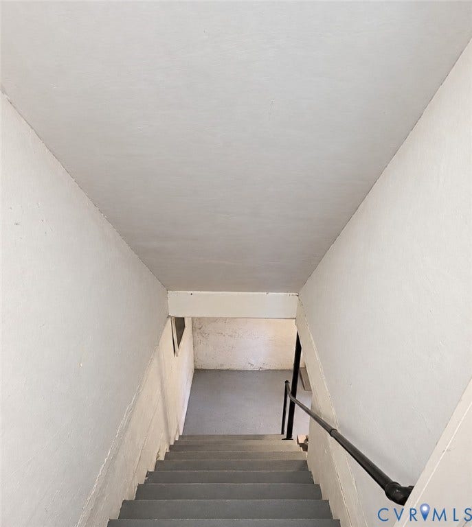 518 Central Terrace, Hopewell, VA 23860 Stairwell with painted walls, painted ceiling, and a black handrail