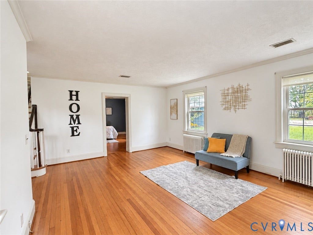 518 Central Terrace, Hopewell, VA 23860 Hardwood flooring, crown molding, white walls, multiple windows, and a doorway
