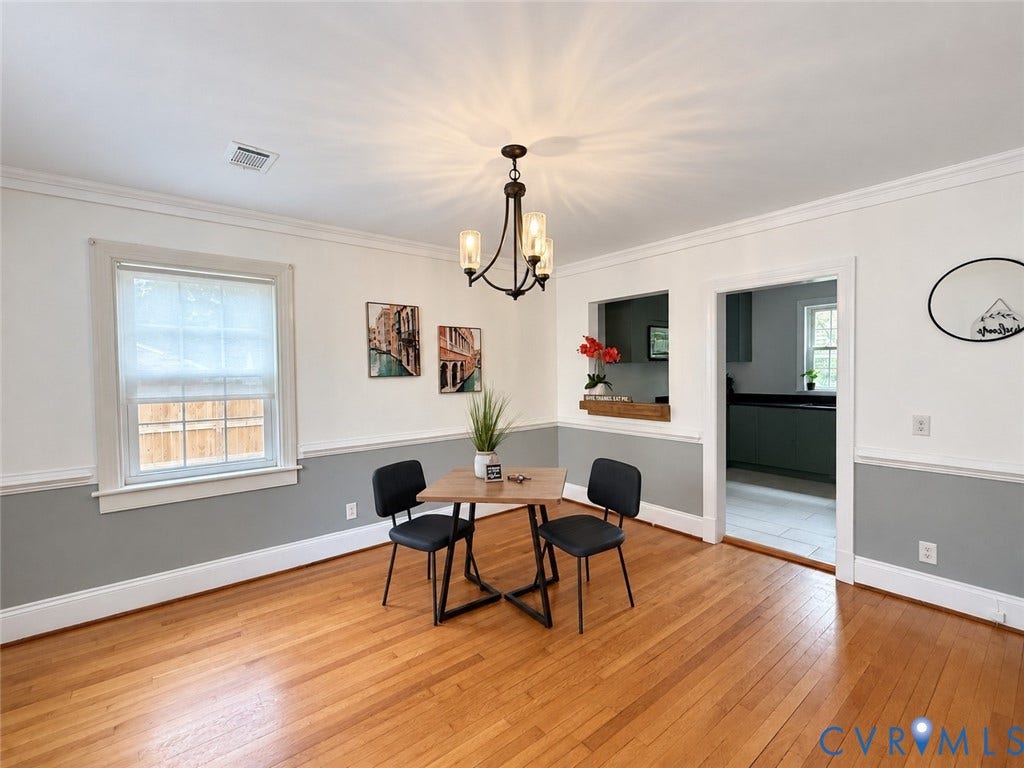518 Central Terrace, Hopewell, VA 23860 Wood-finish flooring, crown molding, chair rail detailing, recessed architectural opening, and an open doorway to an adjacent space