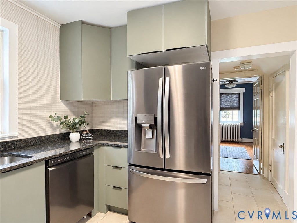 518 Central Terrace, Hopewell, VA 23860 Stainless steel refrigerator, stainless steel dishwasher, dark stone countertops, pale green cabinetry, and a textured tile backsplash