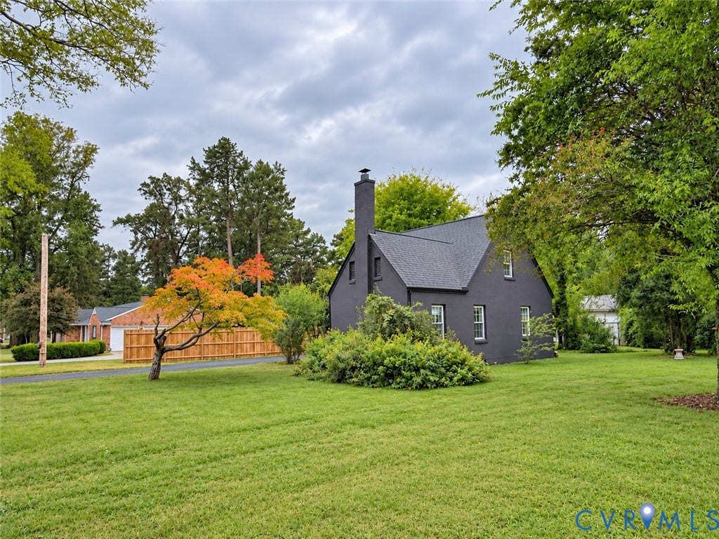518 Central Terrace, Hopewell, VA 23860 Black-painted exterior with a dark roof and prominent chimney