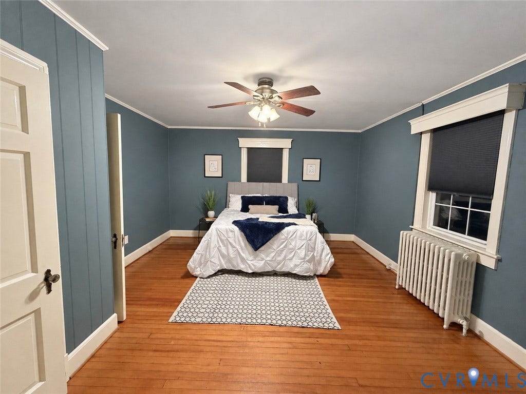 518 Central Terrace, Hopewell, VA 23860 Hardwood flooring, ceiling fan, board and batten wall accent, window with blinds, and white trim