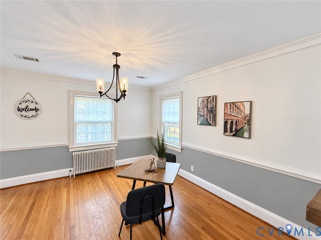 518 Central Terrace, Hopewell, VA 23860 Hardwood flooring, crown molding, two-tone wall treatment, and a three-light chandelier