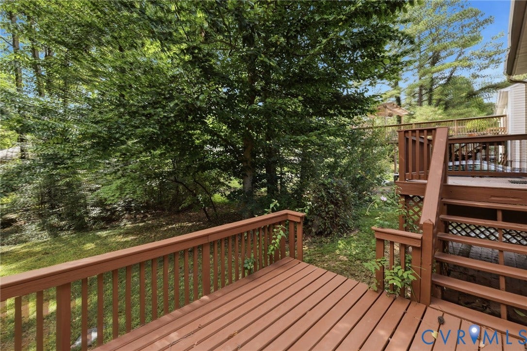 5571 Heatherhill Drive, Whale Rock, North Chesterfield, VA 23234 Multi-level wooden deck with natural wood railing, integrated staircase, and lattice detailing