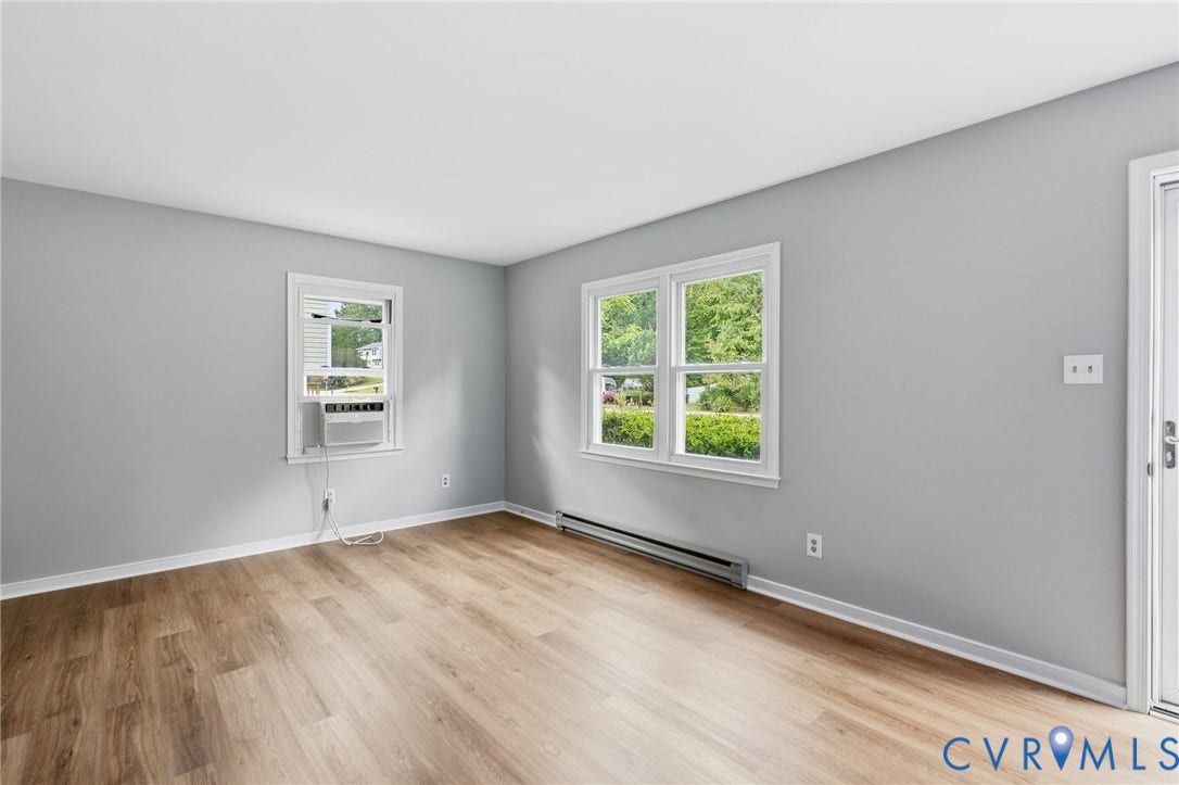 5571 Heatherhill Drive, Whale Rock, North Chesterfield, VA 23234 Wood-finish flooring throughout, light gray wall paint, and white trim accents