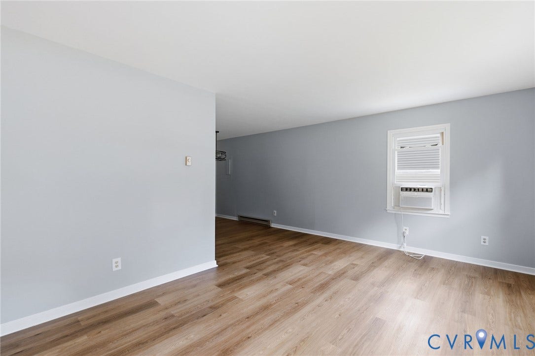5571 Heatherhill Drive, Whale Rock, North Chesterfield, VA 23234 Wood-finish flooring throughout, light-toned wall paint, and a window with blinds providing natural illumination