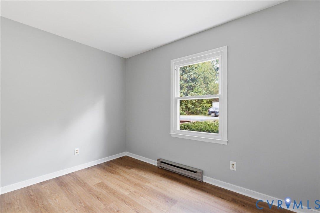 5571 Heatherhill Drive, Whale Rock, North Chesterfield, VA 23234 Wood-finish flooring with light gray walls and white trim