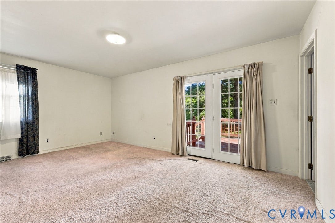 Primary Bedroom has doors to back deck