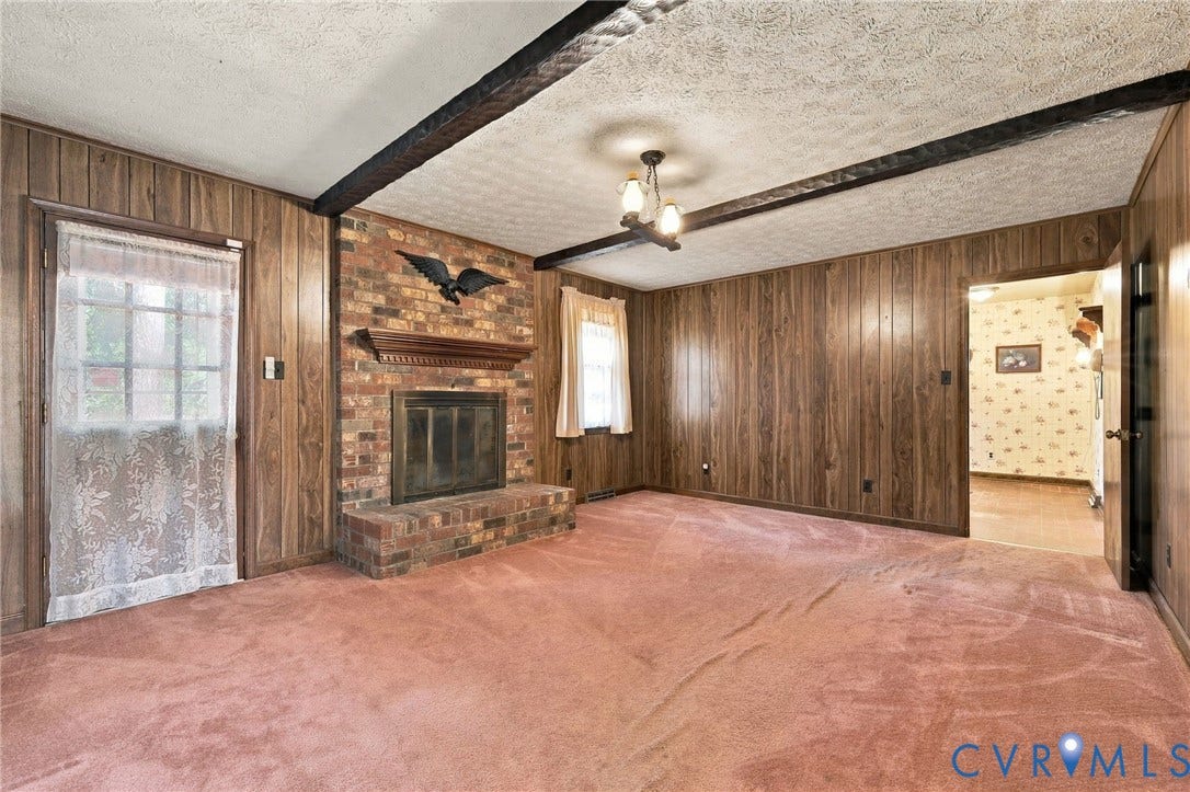 Family room has wood burning fireplace, connects to kitchen