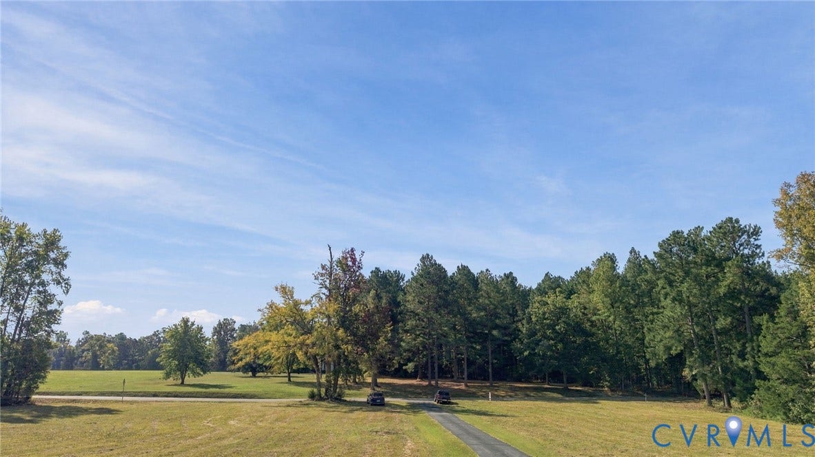Looking from house down driveway and front yard