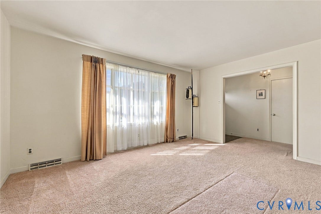 Living room with bay window off the foyer.