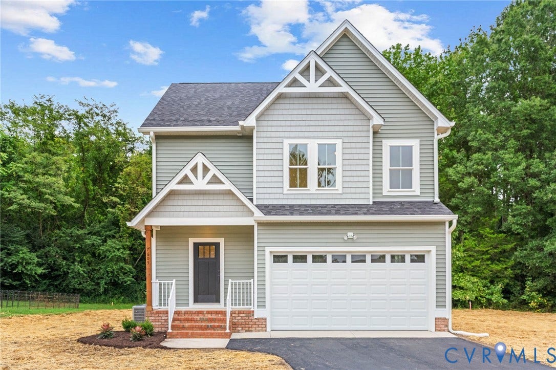 7605 Oster Drive, Chamberlayne Farms Area, Henrico, VA 23227 Two-story residence with a covered front porch, attached garage, and a gabled roofline