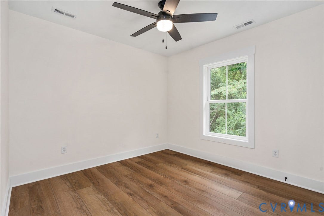 7605 Oster Drive, Chamberlayne Farms Area, Henrico, VA 23227 Wood-finish flooring, white walls, white trim, and a ceiling fan with integrated lighting
