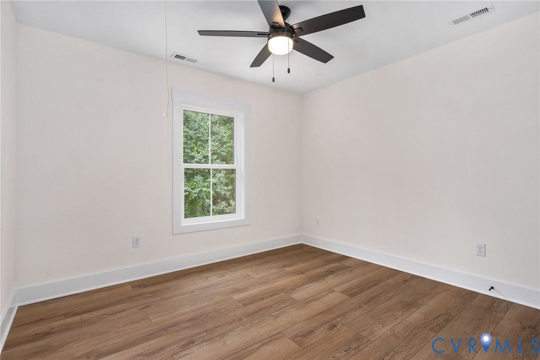 7605 Oster Drive, Chamberlayne Farms Area, Henrico, VA 23227 Wood-finish flooring, white walls, and a ceiling fan with integrated lighting