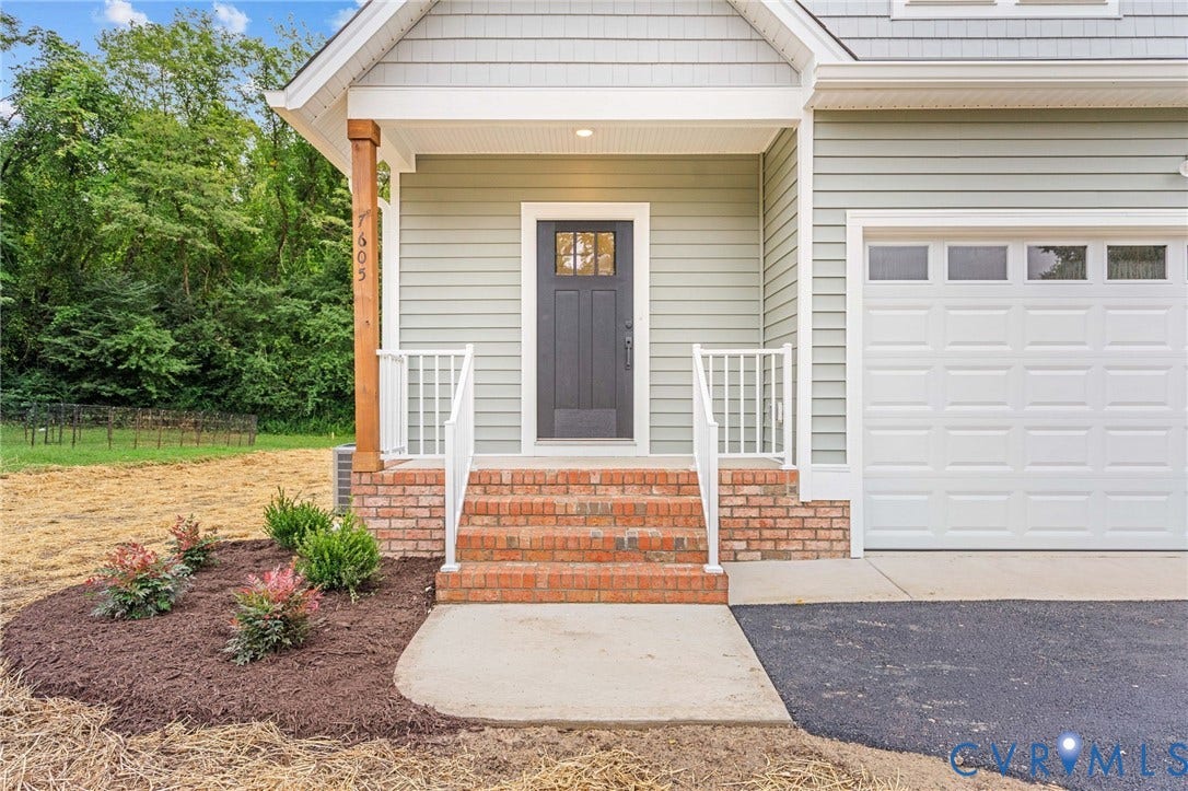 7605 Oster Drive, Chamberlayne Farms Area, Henrico, VA 23227 Faceted front door, brick stairs, and white railings