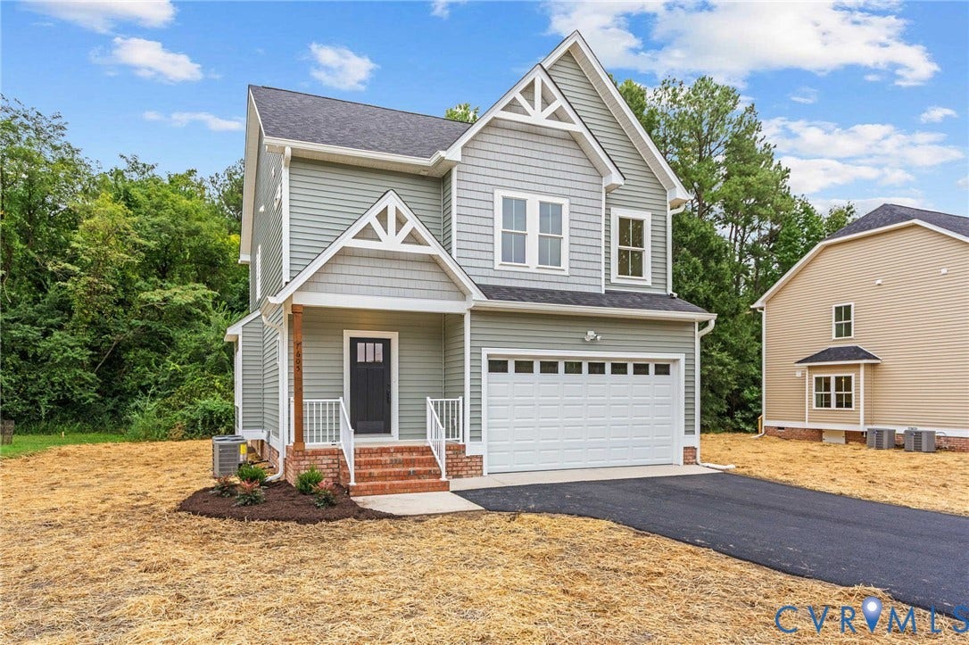 7605 Oster Drive, Chamberlayne Farms Area, Henrico, VA 23227 Craftsman-style exterior with gabled roofline, front porch with white railing, brick steps, and an attached garage with a paved driveway