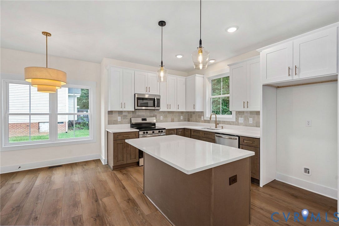7605 Oster Drive, Chamberlayne Farms Area, Henrico, VA 23227 Kitchen featuring a center island with a light-toned countertop, stainless steel appliances, wood-finish flooring, two-tone cabinetry, and recessed lighting
