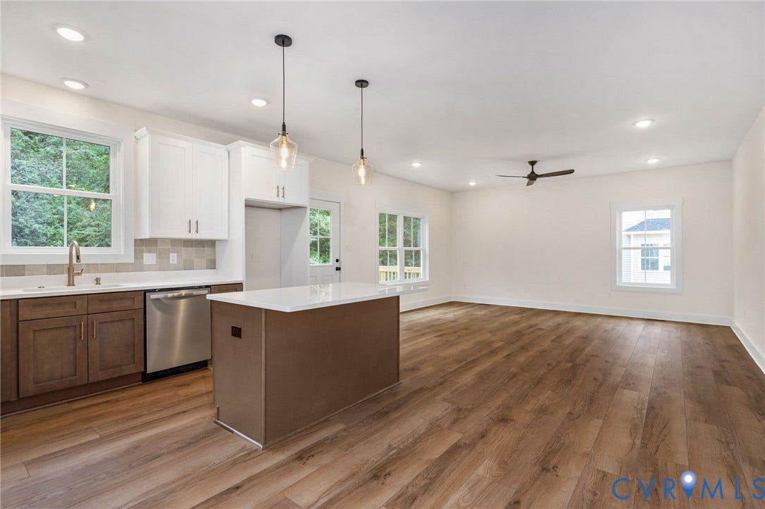 7605 Oster Drive, Chamberlayne Farms Area, Henrico, VA 23227 Wood-finish flooring, two-tone cabinetry with white upper and brown lower cabinets, stainless steel dishwasher, white countertops, and recessed lighting