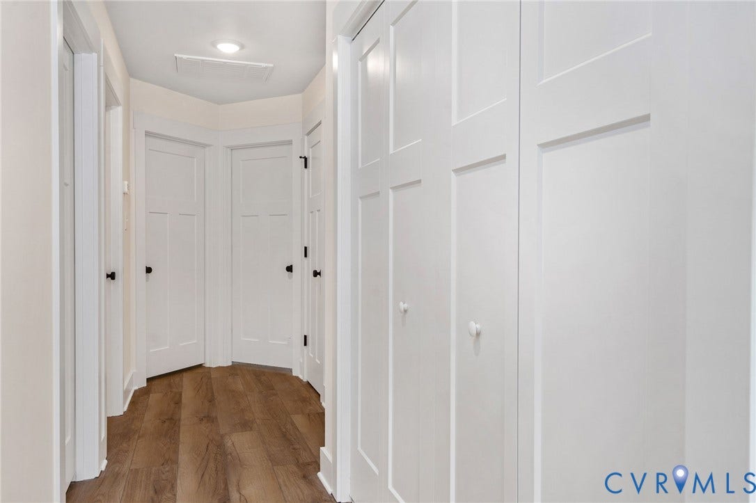7605 Oster Drive, Chamberlayne Farms Area, Henrico, VA 23227 Hallway featuring wood-finish flooring, recessed lighting, white paneled doors, and matte black door hardware