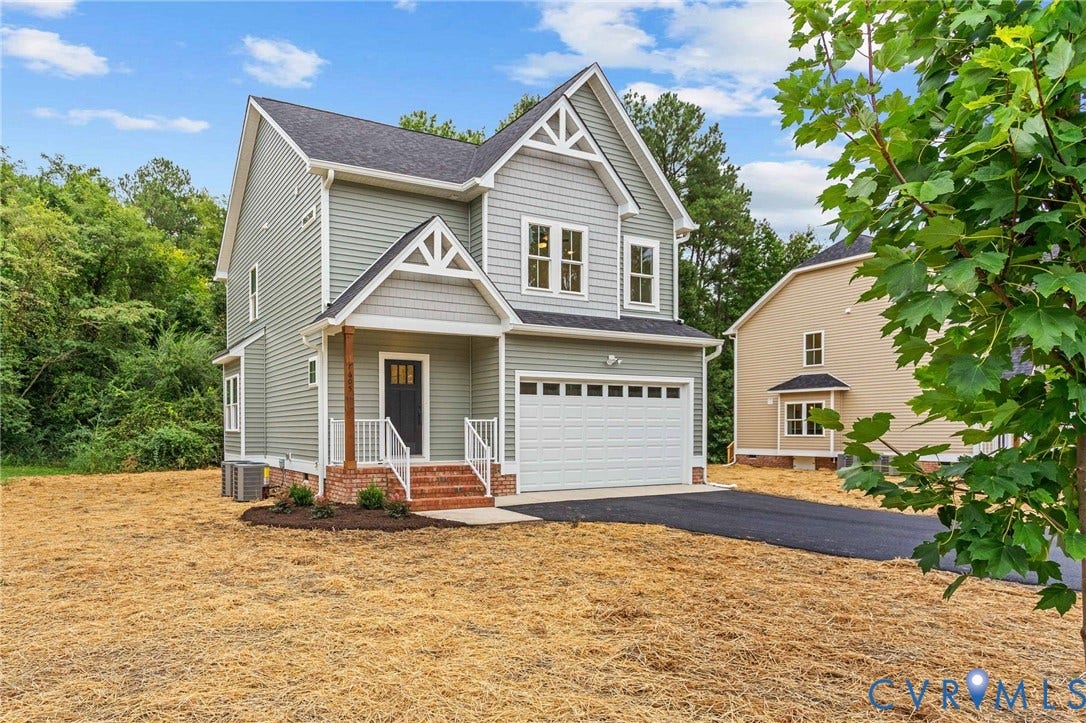 7605 Oster Drive, Chamberlayne Farms Area, Henrico, VA 23227 Contemporary two-story residence featuring light gray siding, white trim, a dark asphalt shingle roof, an attached garage, and a covered front entry with brick steps