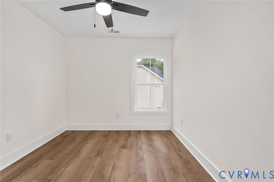 7605 Oster Drive, Chamberlayne Farms Area, Henrico, VA 23227 Wood-finish flooring, white walls, and a contemporary ceiling fan with integrated lighting