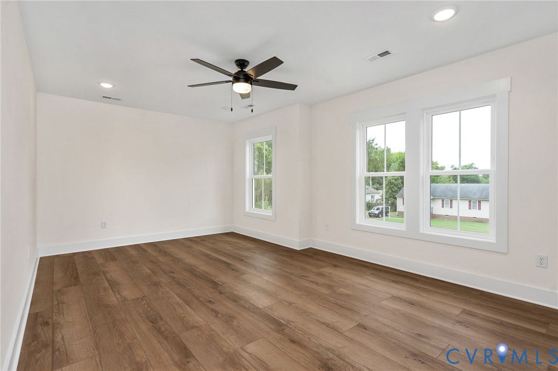 7605 Oster Drive, Chamberlayne Farms Area, Henrico, VA 23227 Spacious room featuring wood-finish flooring, white walls, and a ceiling fan