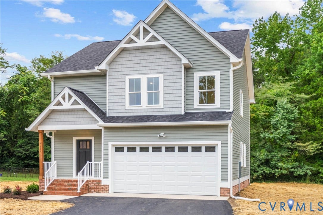 7605 Oster Drive, Chamberlayne Farms Area, Henrico, VA 23227 Two-story residence featuring light gray siding, white trim accents, a single-car garage, and a covered porch with brick steps