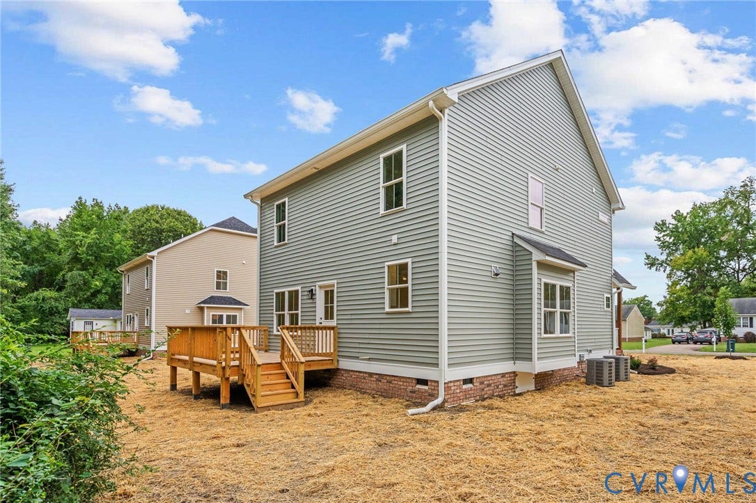7605 Oster Drive, Chamberlayne Farms Area, Henrico, VA 23227 Siding exterior with multiple windows, featuring an outdoor wood deck with stairs and railing, and a bay window
