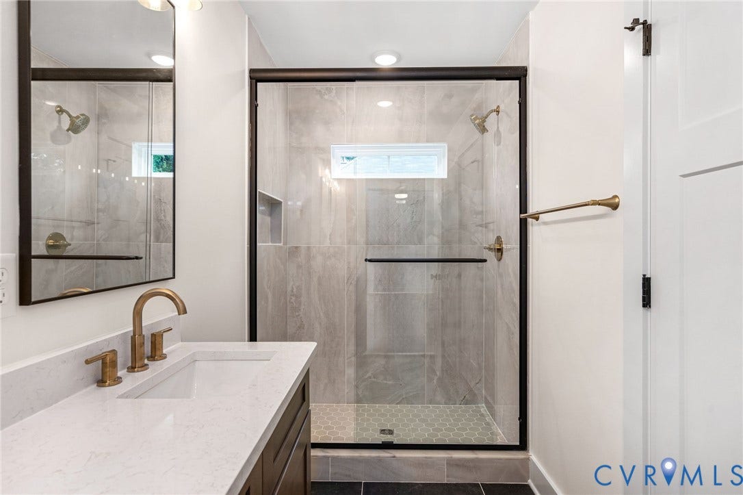 7605 Oster Drive, Chamberlayne Farms Area, Henrico, VA 23227 Walk-in shower with tile surround, glass enclosure, and hexagonal tile flooring