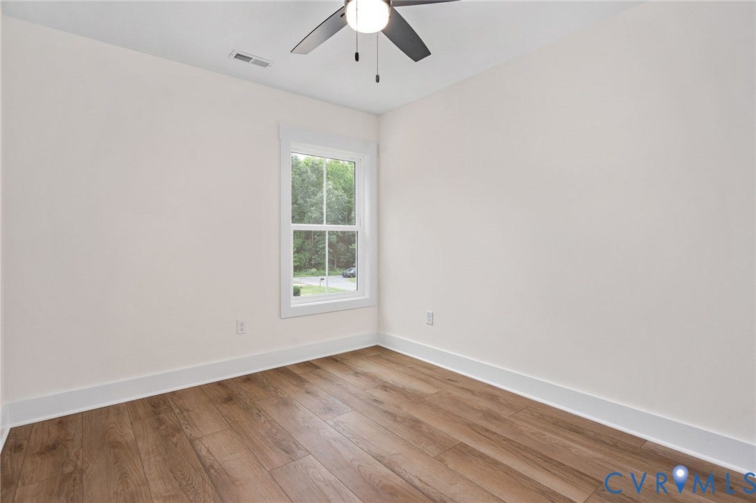 7605 Oster Drive, Chamberlayne Farms Area, Henrico, VA 23227 Wood-finish flooring, white walls, and a ceiling fan with integrated lighting