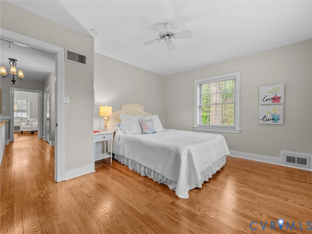 1113 E Durwood Crescent, Tuckahoe Area, Henrico, VA 23229 Hardwood flooring, white window blinds, white ceiling fan, and light wall paint throughout
