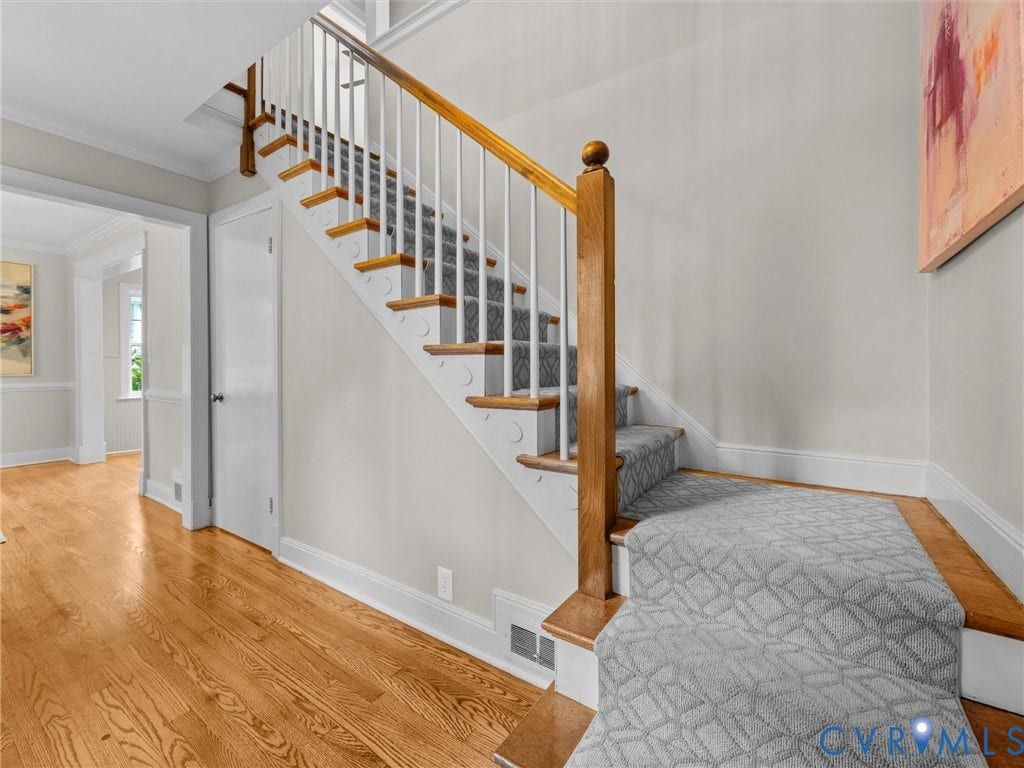 1113 E Durwood Crescent, Tuckahoe Area, Henrico, VA 23229 Hardwood flooring, wood newel post and handrail, white balusters, patterned stair runner, and crown molding