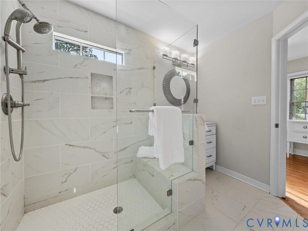 1113 E Durwood Crescent, Tuckahoe Area, Henrico, VA 23229 Walk-in shower with clear glass enclosure, a built-in bench, recessed shelf, and dual shower heads
