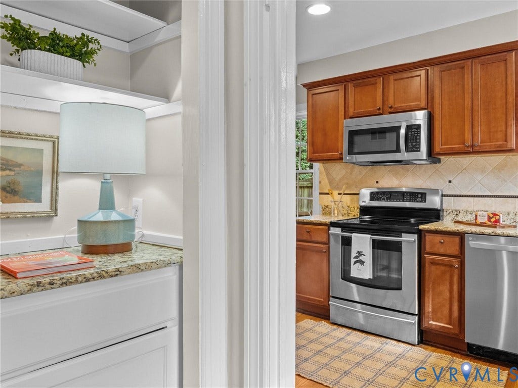 1113 E Durwood Crescent, Tuckahoe Area, Henrico, VA 23229 Wood-finish cabinetry, stainless steel appliances, and stone countertops
