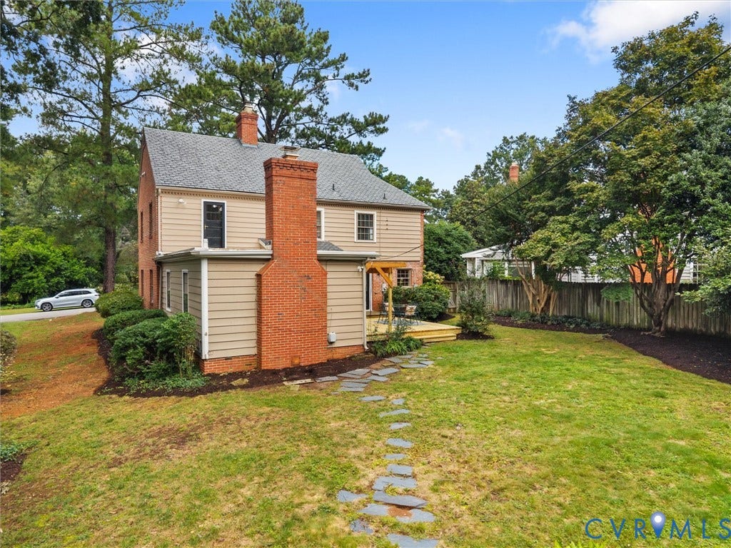 1113 E Durwood Crescent, Tuckahoe Area, Henrico, VA 23229 Expansive backyard featuring a stone pathway, mature trees, wood privacy fence, and a multi-level wood deck