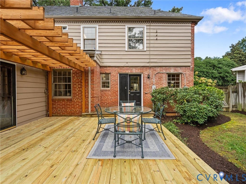 1113 E Durwood Crescent, Tuckahoe Area, Henrico, VA 23229 Expansive rear deck with a pergola, brick and siding exterior, and established landscaping