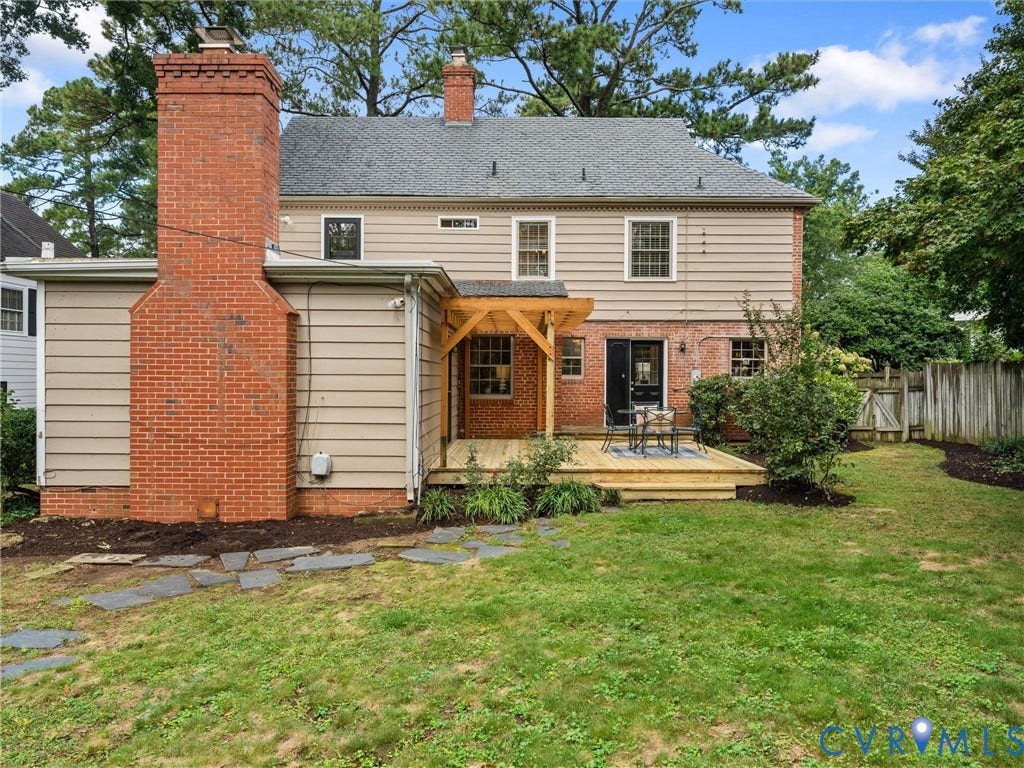 1113 E Durwood Crescent, Tuckahoe Area, Henrico, VA 23229 Expansive lawn featuring a wooden deck with a pergola, brick chimney, and stone pathway