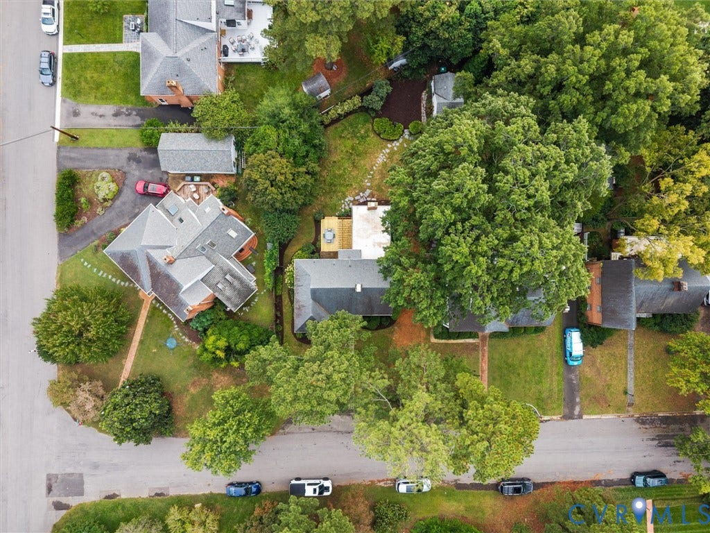1113 E Durwood Crescent, Tuckahoe Area, Henrico, VA 23229 Residential property featuring a shingled roof, multiple chimneys, and surrounding mature trees