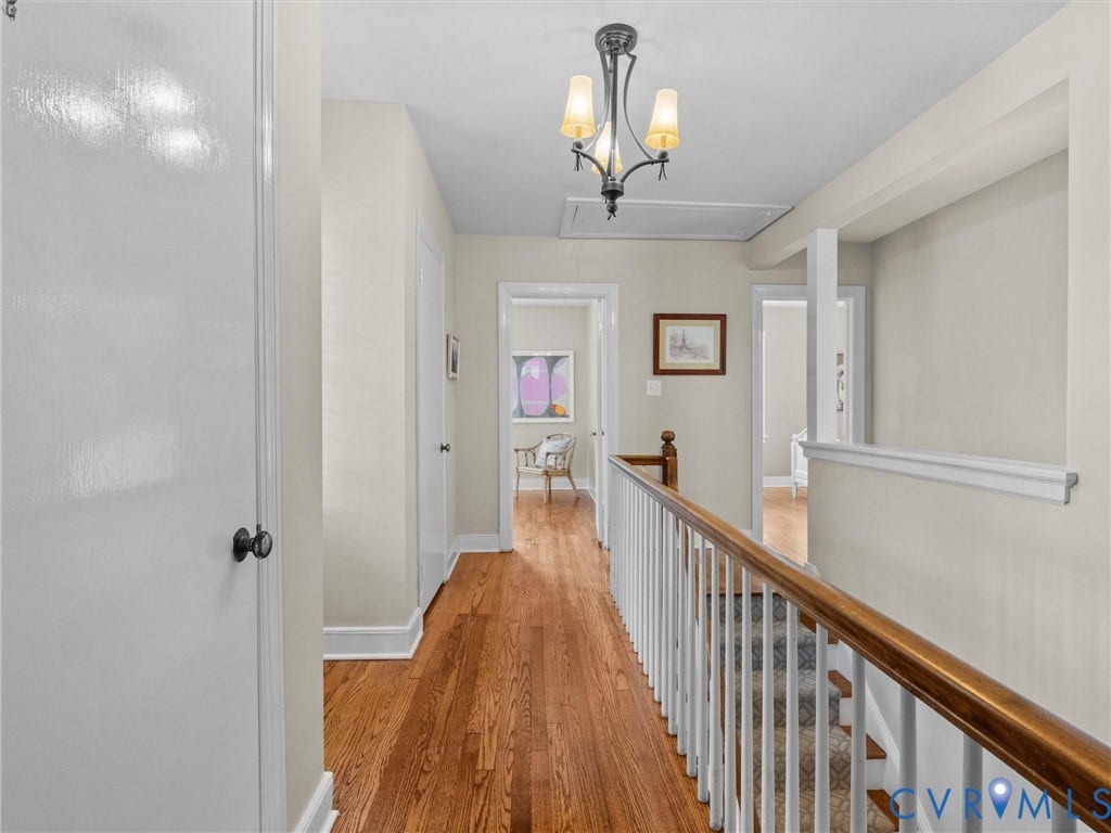 1113 E Durwood Crescent, Tuckahoe Area, Henrico, VA 23229 Hardwood flooring, painted white walls, white trim, wood and white balustrade, and a decorative ceiling light fixture