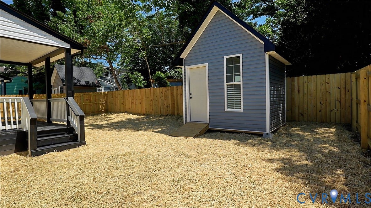 326 Mars Street, Petersburg, VA 23803 Private yard with wood privacy fencing, a covered deck, and a detached outbuilding