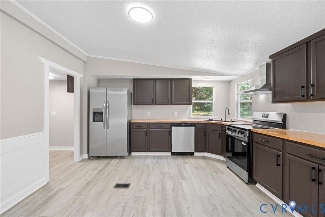 115 Mount Airy Lane, Cumberland, VA 23040 Kitchen featuring wood-finish flooring, dark wood-finish cabinetry, stainless steel appliances, wood-finish countertops, and recessed lighting