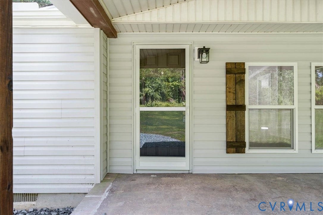 115 Mount Airy Lane, Cumberland, VA 23040 White vinyl siding exterior with a concrete porch