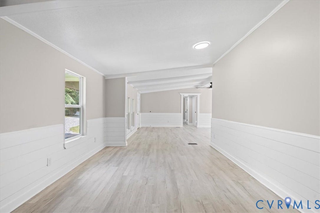 115 Mount Airy Lane, Cumberland, VA 23040 Light wood-finish flooring, vaulted ceilings with exposed beams, recessed lighting, and white shiplap wainscoting